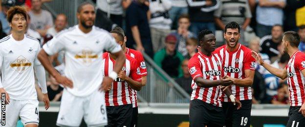 Victor Wanyama celebrates his goal with team-mates at the Liberty Stadium