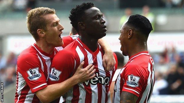 Victor Wanyama (centre) celebrates his goal at the Liberty Stadium