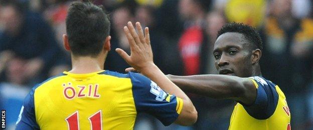 Arsenal duo Mesut Ozil and Danny Welbeck celebrate during the win at Aston Villa