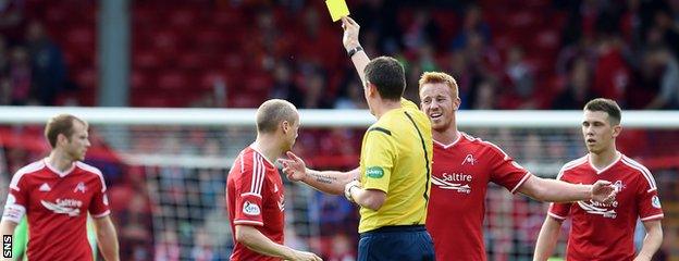 Willo Flood and Ryan Jack are both booked after the Dons pair clashed before half time