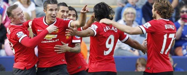 Robin van Persie celebrates with team-mates