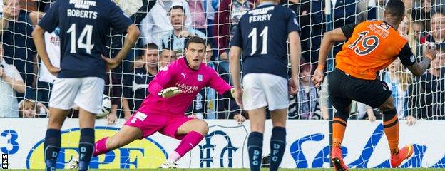 Mario Bilate fires Dundee United into the lead at Dens Park with a first-half penalty