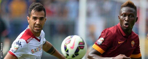 Roma's on-loan Newcastle defender Mapou Yanga-Mbiwa in action against Cagliari forward Marco Sau