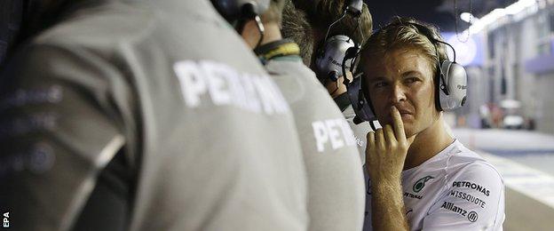 Nico Rosberg watches from pitwall after retiring from Singapore Grand prix