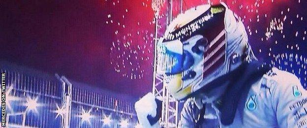 Lewis Hamilton celebrates his victory at the Singapore Grand Prix