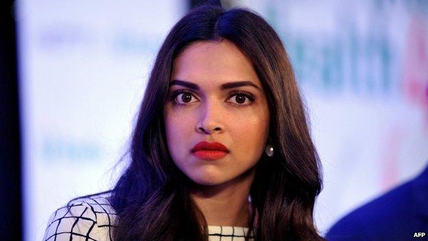 Indian Bollywood film actress Deepika Padukone poses for reporters in Mumbai on September 12, 2014.