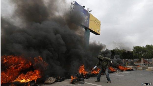 Man burns tyres in Sanaa in protest at fuel price rises (30/07/14)