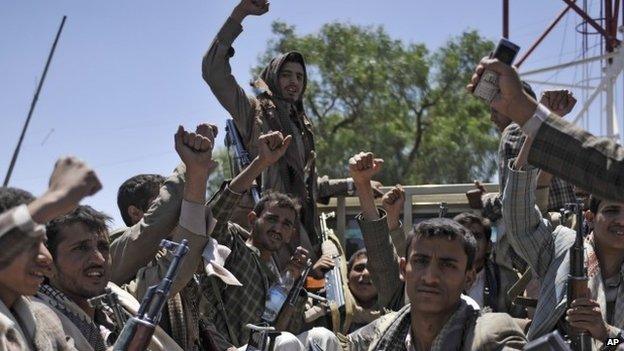 Shia Houthi rebels ride in a pickup truck at the army's First Armoured Division compound in Sanaa, Yemen, on 22 September 2014.