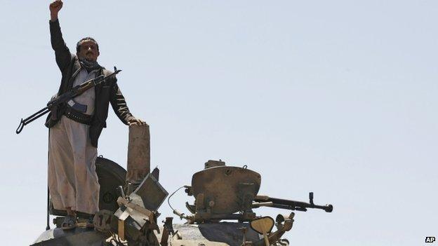 A Houthi rebel on a Yemeni government tank the Shia group took over, in Sanaa, Yemen, on 22 September 2014.