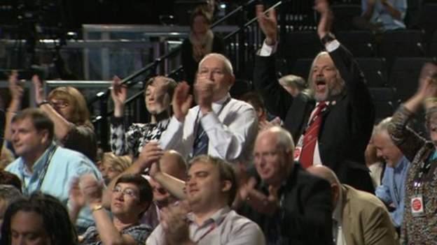 Delegates applaud union official Manuel Cortes after he called for the railways to be nationalised