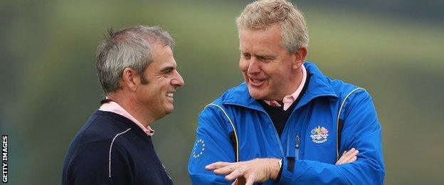 Colin Montgomerie (right) chats with vice captain Paul McGinley during a practice round prior to the 2010 Ryder Cup at the Celtic Manor Resort