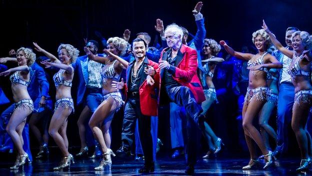 Jonathan Pryce performs with Jon Jon Briones and other members of the Miss Saigon cast