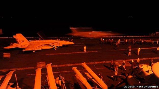 F/A-18s launch attacks on IS targets from aircraft carrier USS George HW Bush