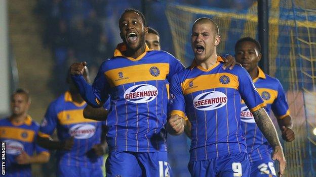 James Collins of Shrewsbury Town celebrates scoring the opening goal with team-mates