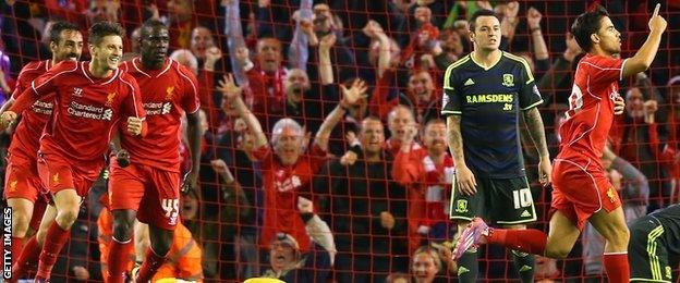 Suso celebrates with team-mates