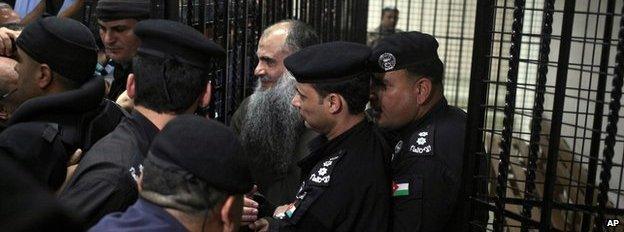 Family and friends of Abu Qatada surround him after he was acquitted on 24 September 2014