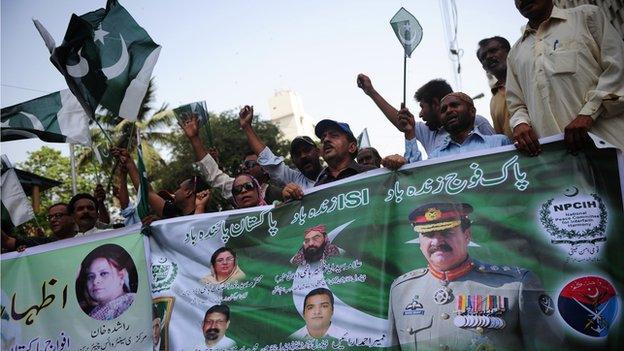 Pakistani civil society activists protest in support of the army as well the spy agency ISI in Karachi on May 4, 2014