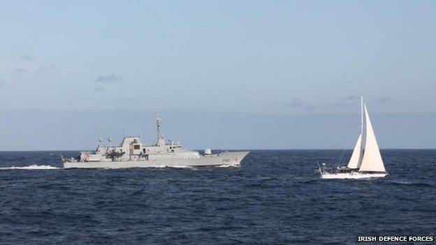 The Irish naval vessel - the LÉ Niamh, sails alongside the detained yacht Makayabella