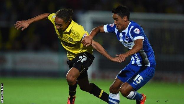 Marcus Harness of Burton Albion battles with Adam Chicksen of Brighton