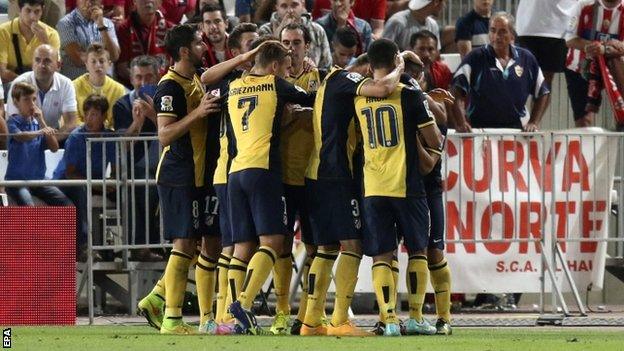 Atletico celebrate Miranda goal