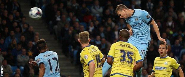 Edin Dzeko scores for Manchester City