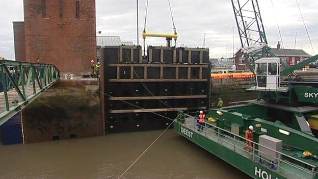 Lock gates being craned into dock