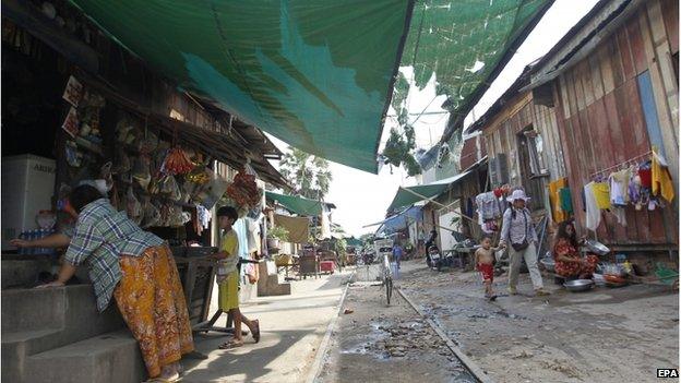 Cambodians live along a railway line near the train station in Phnom Penh, Cambodia, 25 September 2014