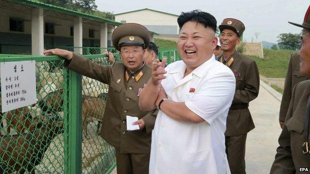 North Korean leader Kim Jong-un (C) reacting as he visits the North Korean People's Army Breeding Station No. 621