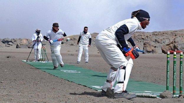 Cricketers play on 26 September 2014 in a crater of Mt Kilimanjaro in Tanzania