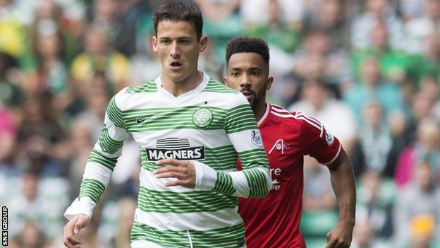 Celtic's Aleksandar Tonev breaks clear of Shay Logan (right)