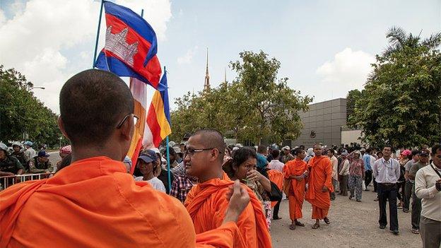 Protesters gather outside the Australian Embassy ahead of the signing of a refugee deal between Australia and Cambodia