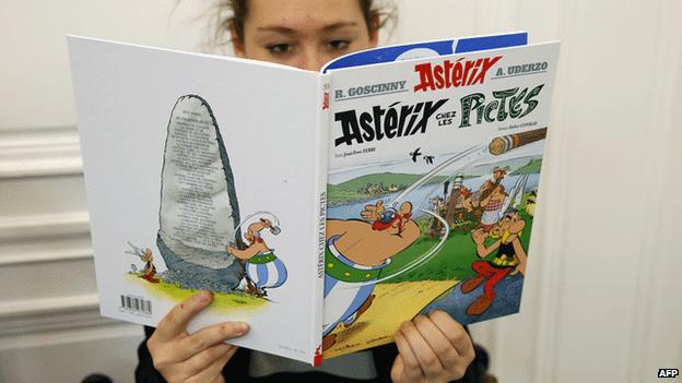 A girl reads Asterix And The Picts just after its release in Paris, 23 October 2013