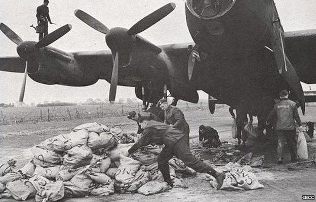 Lancaster bomber being loaded with food