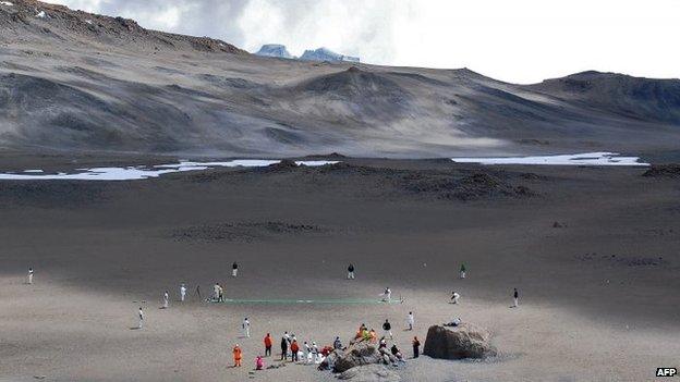 Cricketers play on 26 September 2014 in a crater of Mt Kilimanjaro in Tanzania