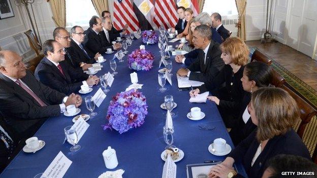 President al-Sisi (L) and President Obama talk across the table