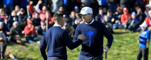 Rickie Fowler and Jimmy Walker celebrate on the final green