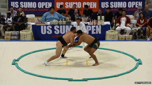 Sumo wrestlers fight during their bout at the US Sumo Open in Long Beach on 20 September, 2014