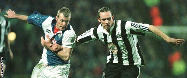 Darren Peacock and Alan Shearer vie for the ball