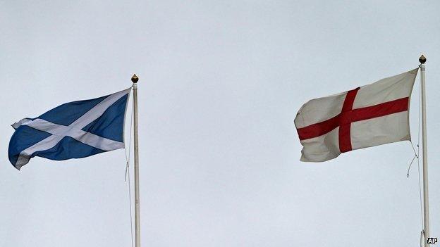 Scottish Saltire and English St George's flag flying side-by-side