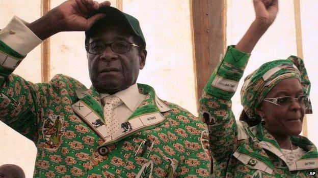 Zimbabwe President Robert Mugabe, left, and his wife Grace, right, in Bindura, Zimbabwe - December 2008