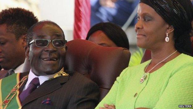 Zimbabwe's President Robert Mugabe and his wife Grace attend a rally in Harare, 12 August 2014