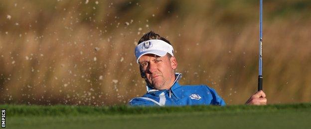 Ian Poulter plays a bunker shot