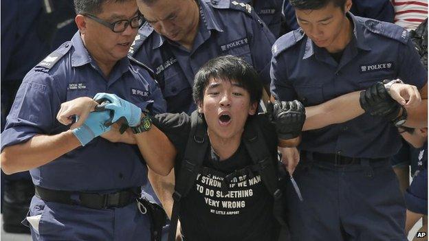 A protester is led away by Hong Kong police, 27 Sep 2014