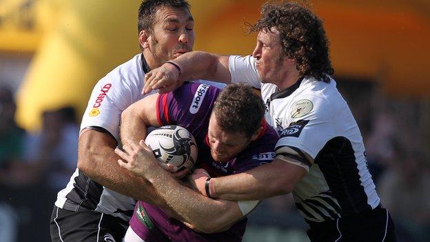 Craig Gilroy is tackled by Zebre duo Mauro Bergamasco and Quintin Geldenhuys