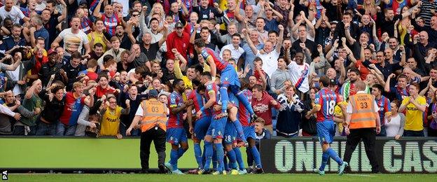 The Palace players celebrate after Mile Jedinak's goal