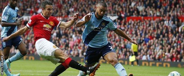 Manchester United striker Robin Van Persie scores against West Ham