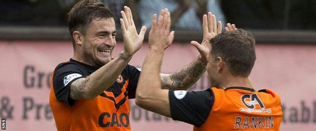 Paul Paton celebrates scoring United's second goal with John Rankin