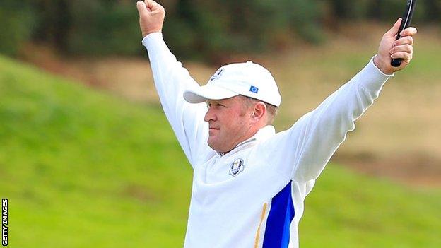 Jamie Donaldson celebrates holing a putt