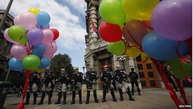 Riot police stand guard during the Gay Pride march in Belgrade.