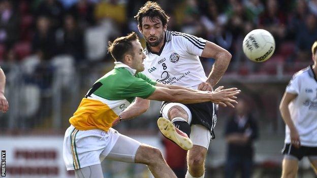 Carrickmore's Mark Donnelly and Omagh's Joe McMahon